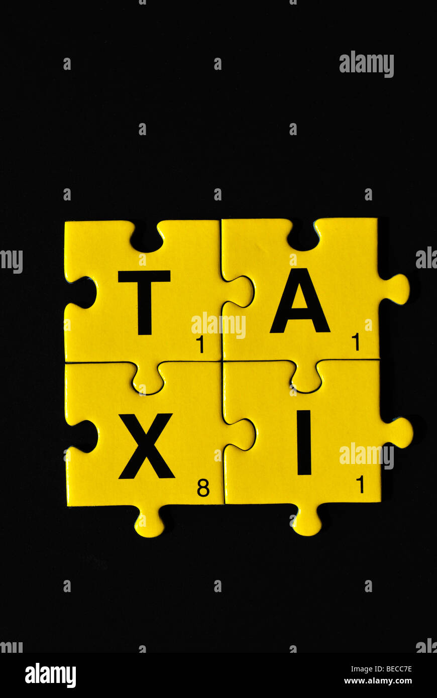 Puzzle pieces building the word taxi Stock Photo