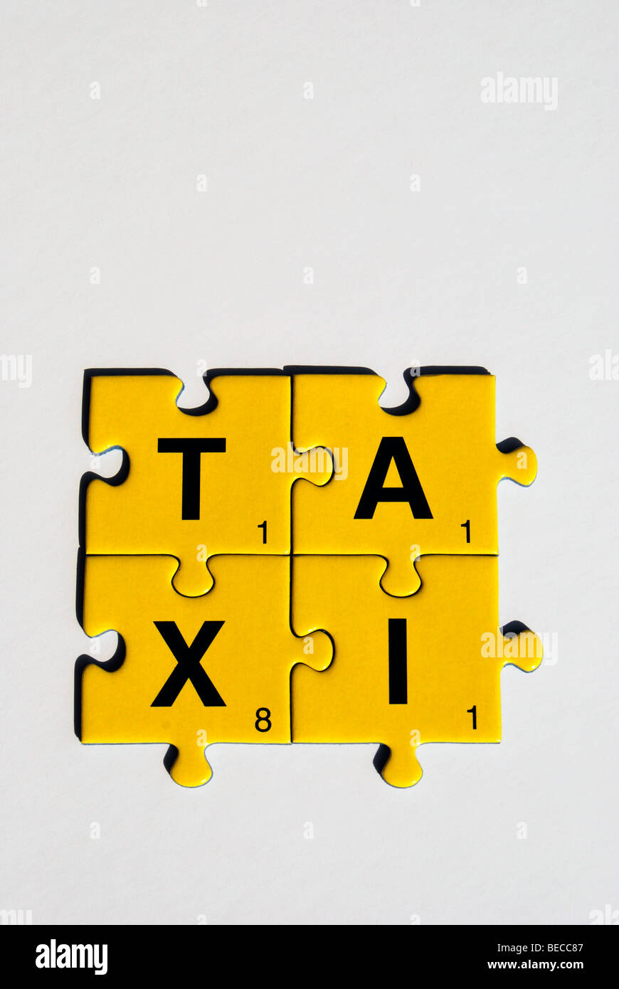 Puzzle pieces building the word taxi Stock Photo