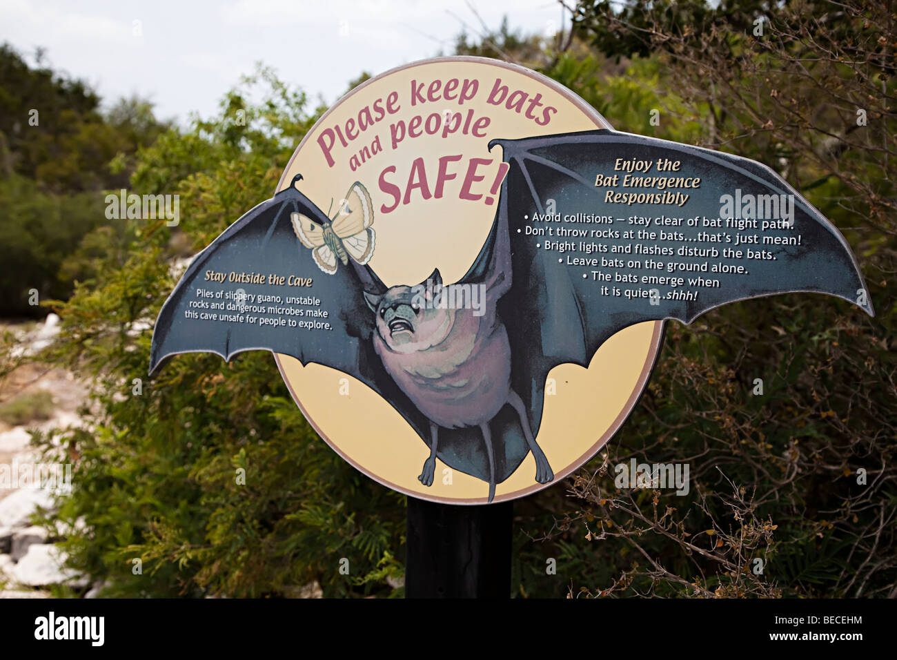 Sign about bats and safety at entrance to Stuart Bat Cave Texas USA Stock Photo