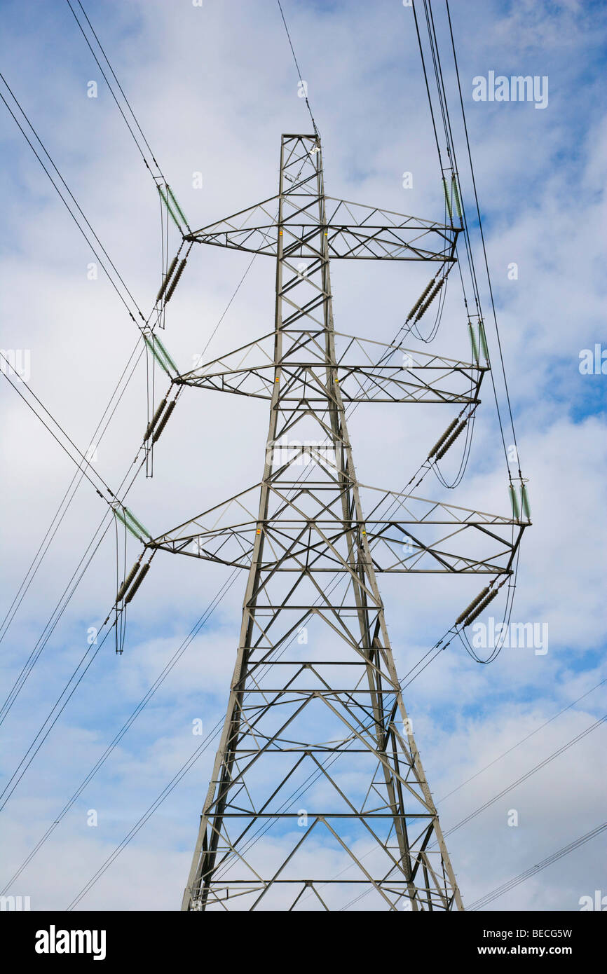High voltage power lines, electrical tower against blue sky Stock Photo ...