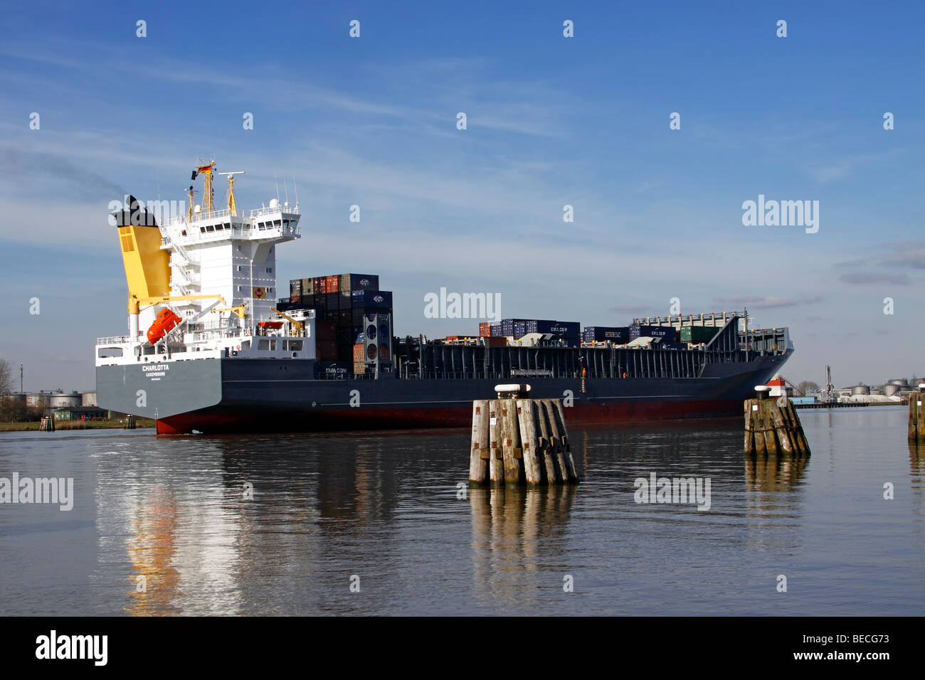 Freighter, container ship 'Charlotta' on the Kiel-Canal in Brunsbuettel, district Dithmarschen, Schleswig-Holstein, Germany, Stock Photo