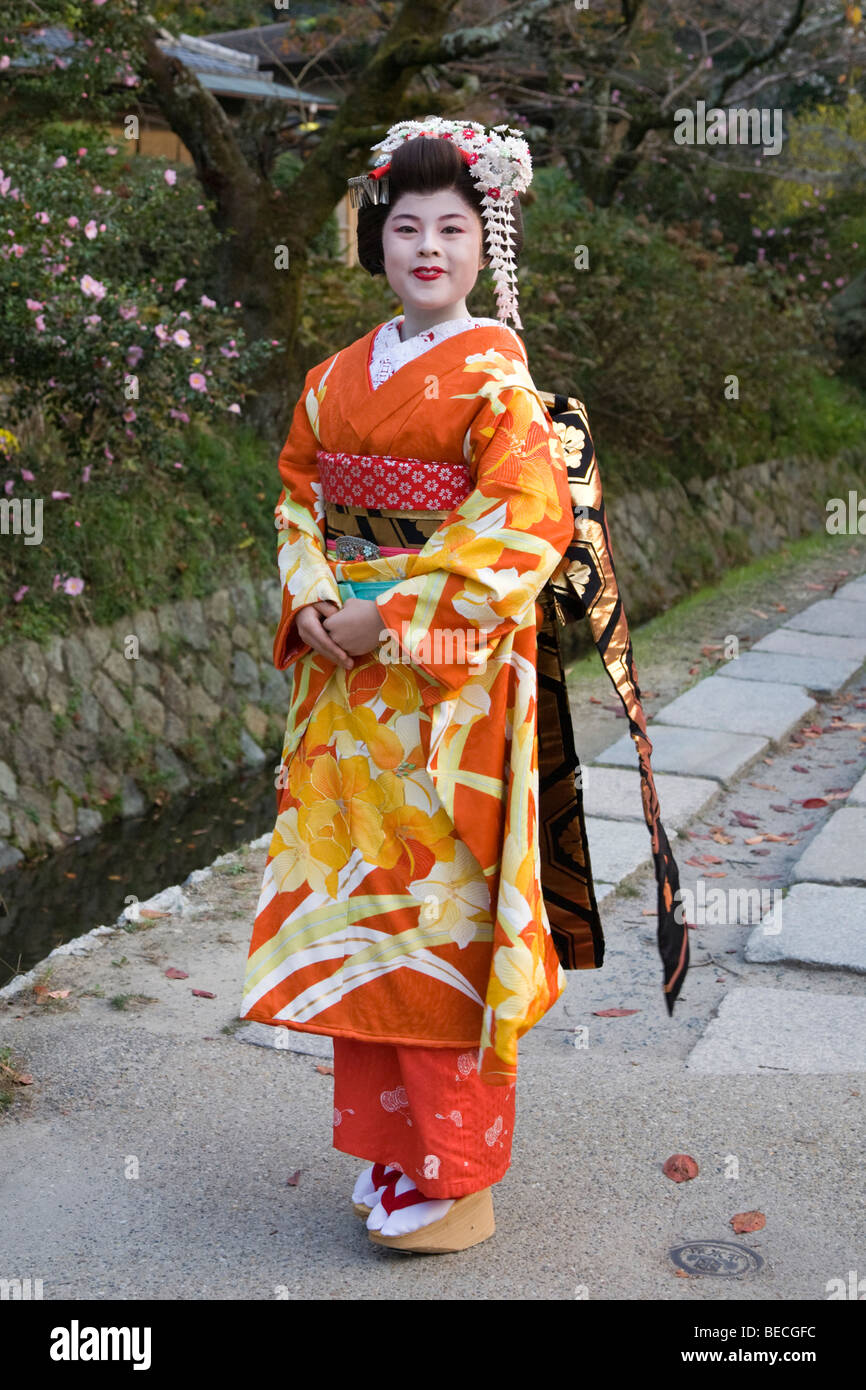 Maiko or apprentice Geisha all dolled up and posing along the Tetsugaku-no-Michi, Stock Photo