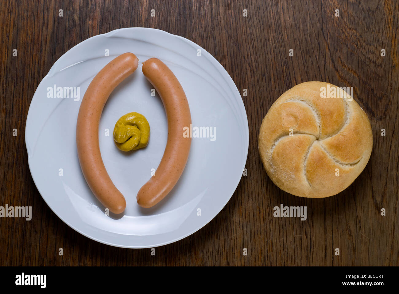 Wiener sausages with Semmel roll and medium hot mustard Stock Photo