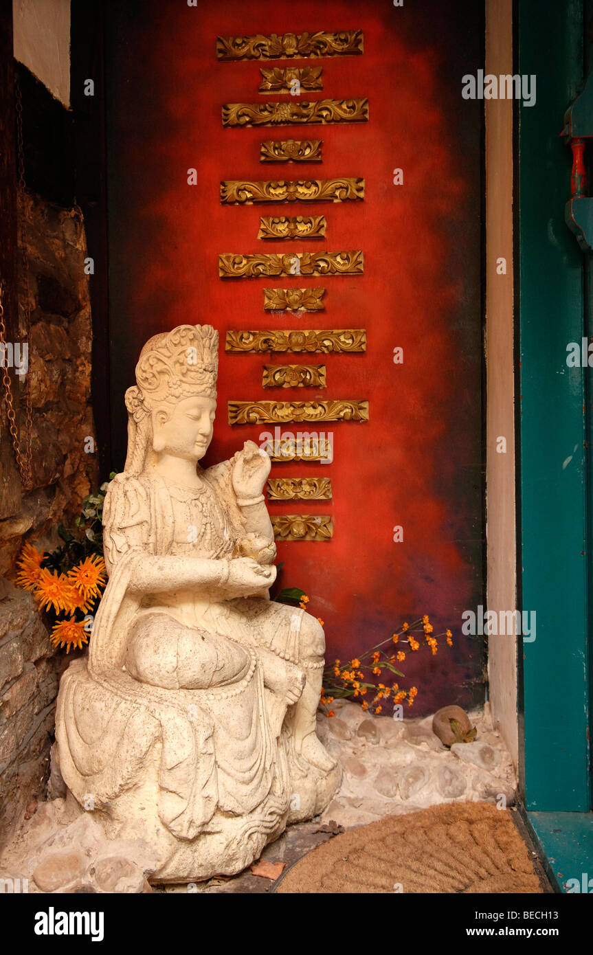 Asian figure in the entrance of a restaurant, Rye, county of Kent, England, Europe Stock Photo