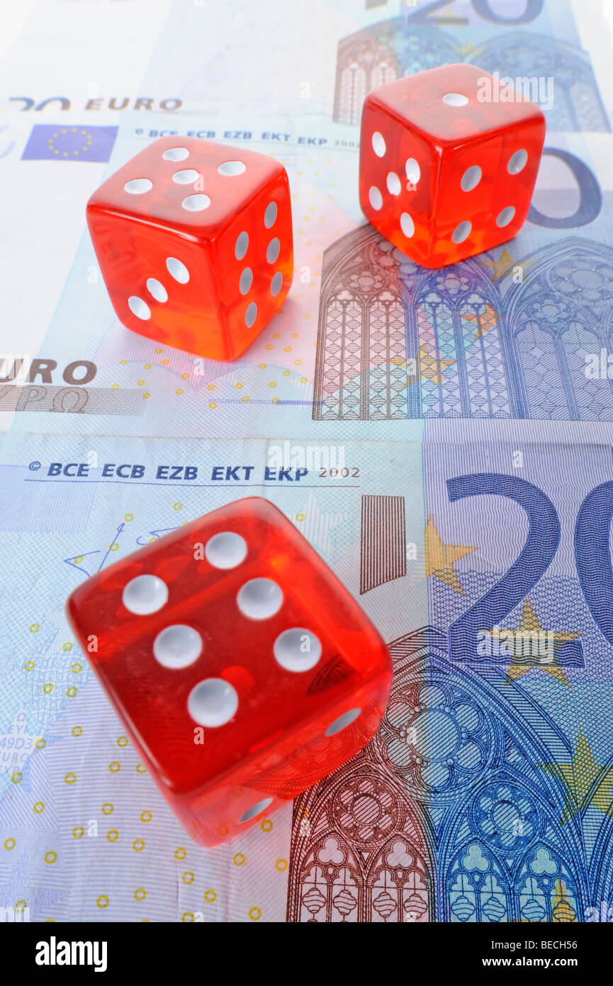 Dice, banknotes, symbolic picture for gambling Stock Photo
