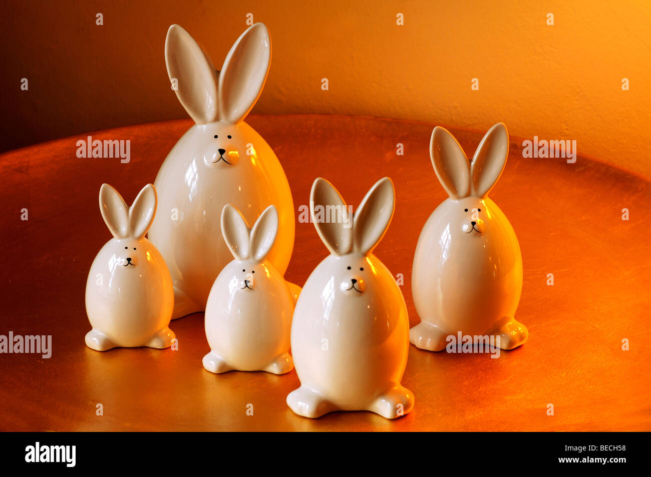 Easter decoration, white porcelain bunnies on a golden plate, Villa Ambiente, Nuremberg, Middle Franconia, Bavaria, Germany, Eu Stock Photo