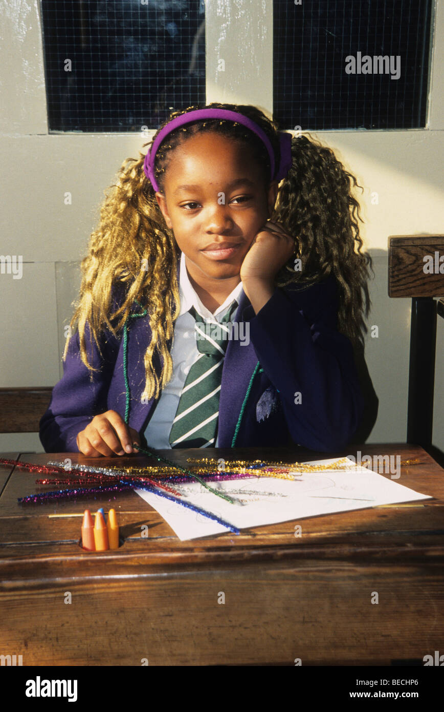 Pretty black schoolgirl with hair extensions Stock Photo