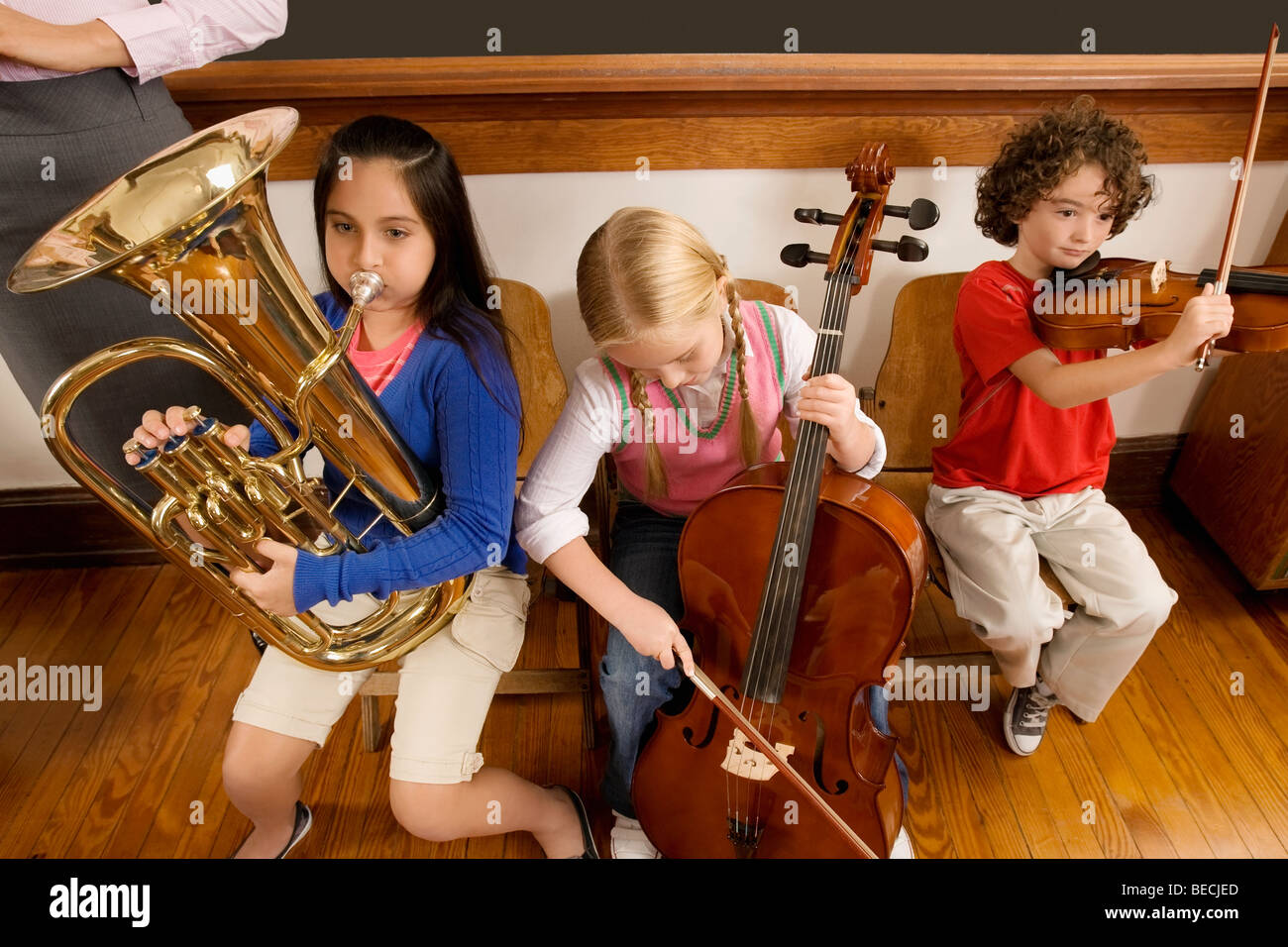 Elementary School Students Playing Instruments Stock Photos