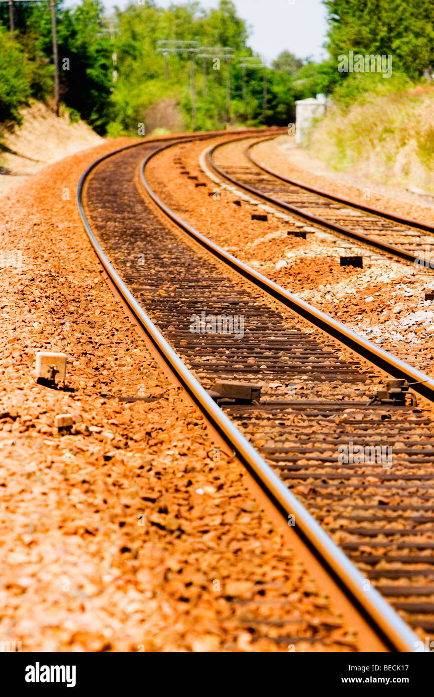 Railroad track passing through a landscape Stock Photo - Alamy