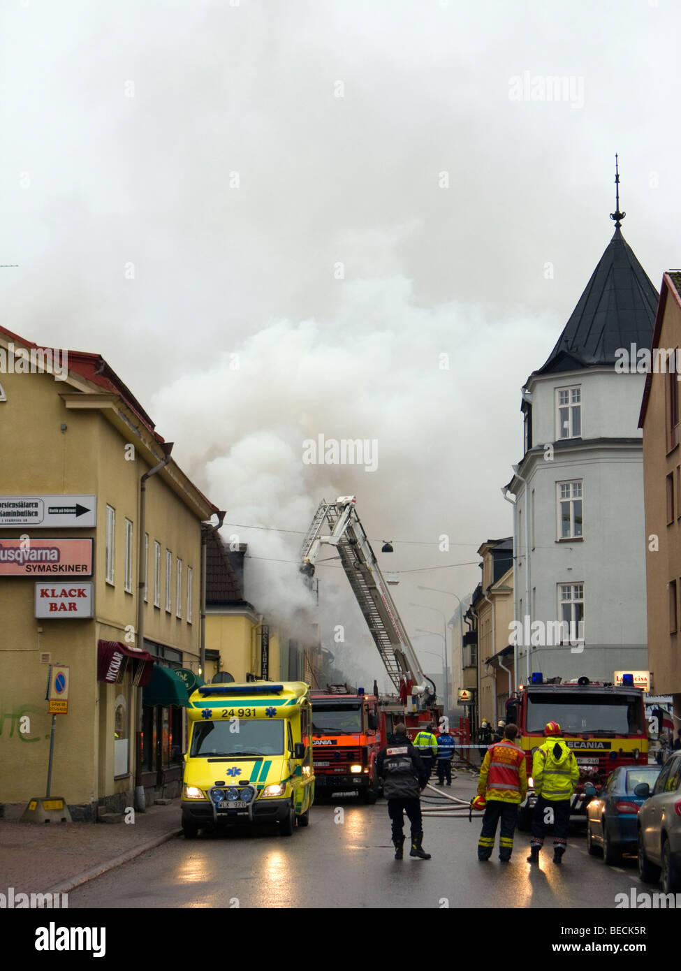 Firemen fighting the fire at Blue Moon Bar in Nyköping, Sweden Stock Photo