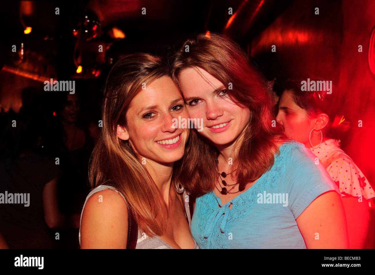 Two young ladies in a night club, nightlife, Madrid, Spain, Iberian Peninsula, Europe Stock Photo