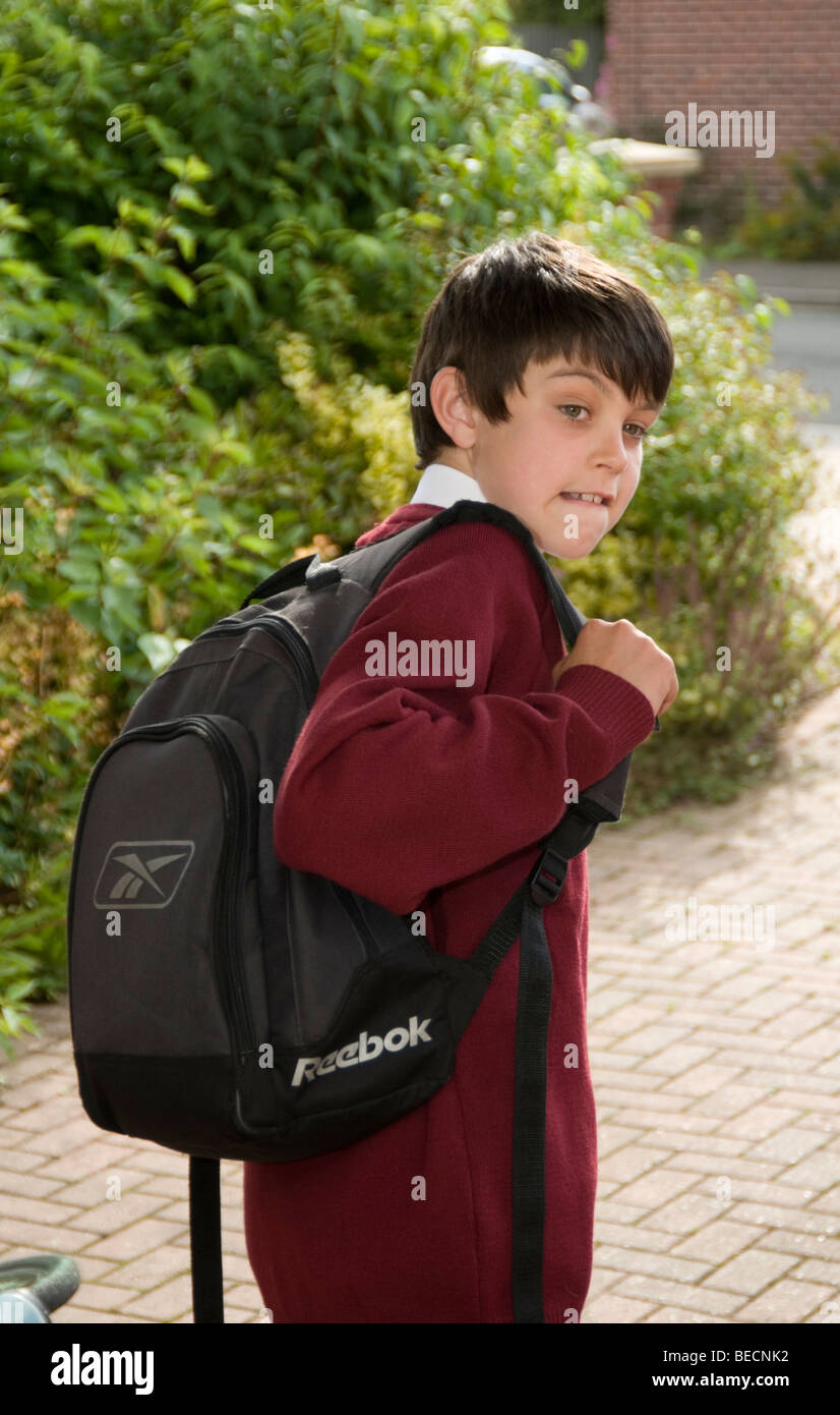 boy child children children's first day at school nerves nervous kid schoolbag bag rucksack education starting a new secondary l Stock Photo