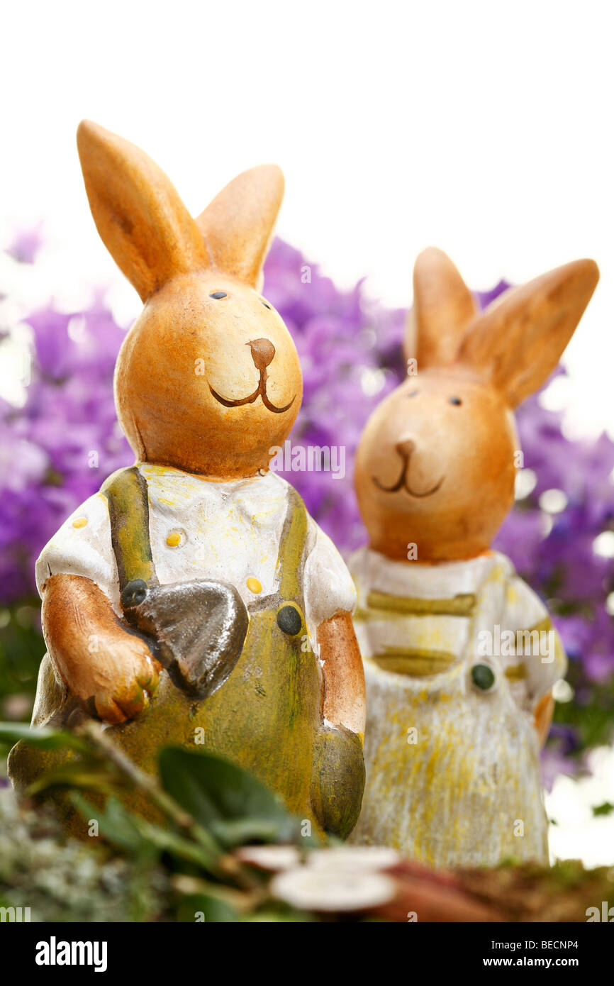 Easterbunnies with bellflowers (Campanula) Stock Photo