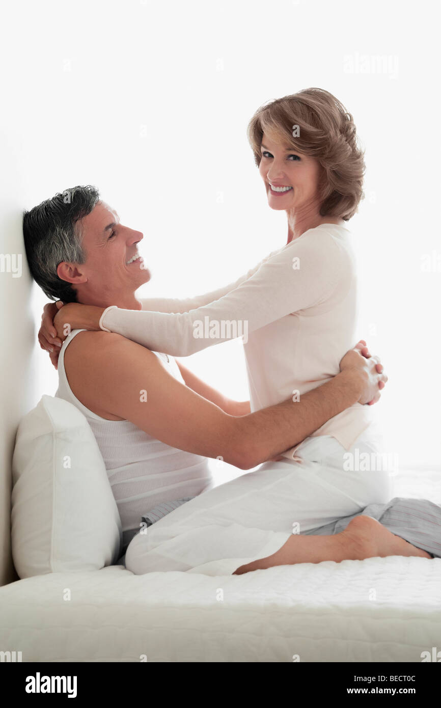 Couple romancing in the bedroom Stock Photo - Alamy