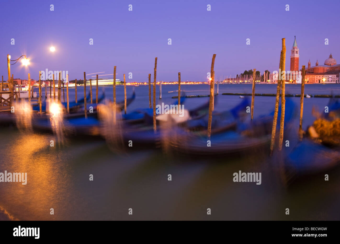 Horizontal Photograph of Gondolas at San Marco with San Giorgio Maggiore in the distance, Twilight, Venice Italy Stock Photo