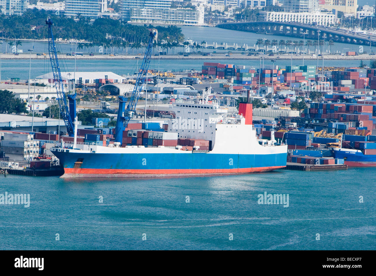 Container ships and cargo containers at a commercial dock Stock Photo