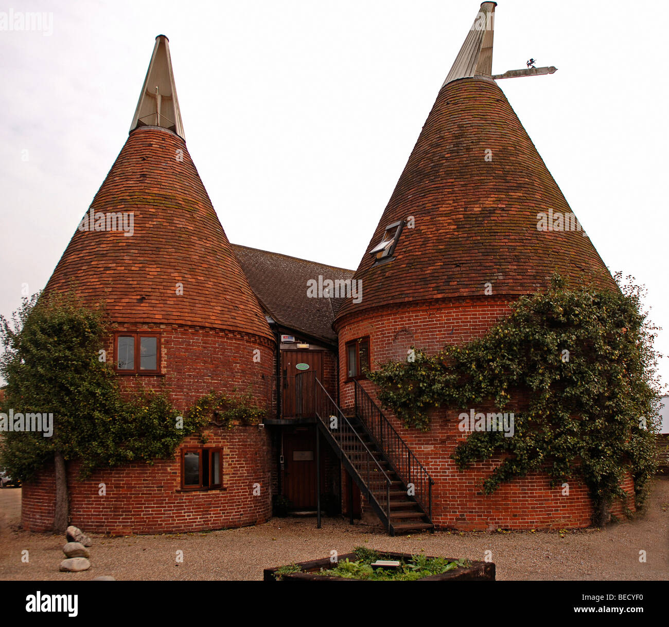Two oast houses, for drying hops, now rebuilt into a flat, county of Kent, England, Europe Stock Photo