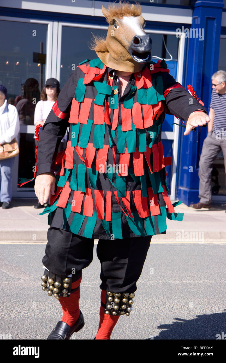 A member of a Morris Dance group wearing traditional costume and Horse's Head, Swanage Folk Festival, Dorset, 2009 Stock Photo