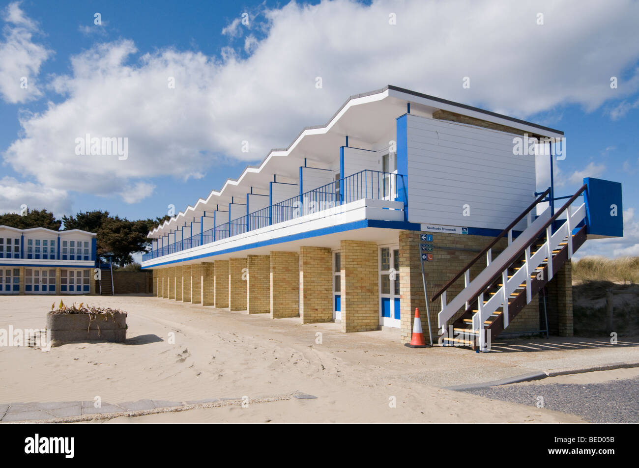 2 storey  Beach chalets at Sandbanks, south coast of England after a winter storm with sand blown onto the courtyard. Stock Photo