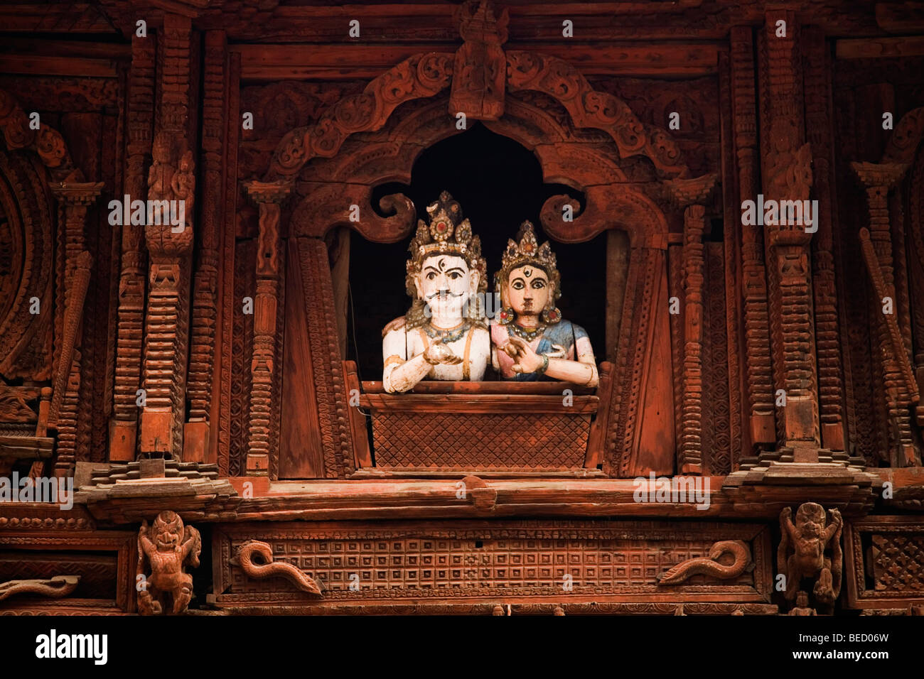 Durbar Square Window Faces- Kathmandu Durbar Square holds the palaces of the Malla and Shah kings who ruled over the city. Stock Photo