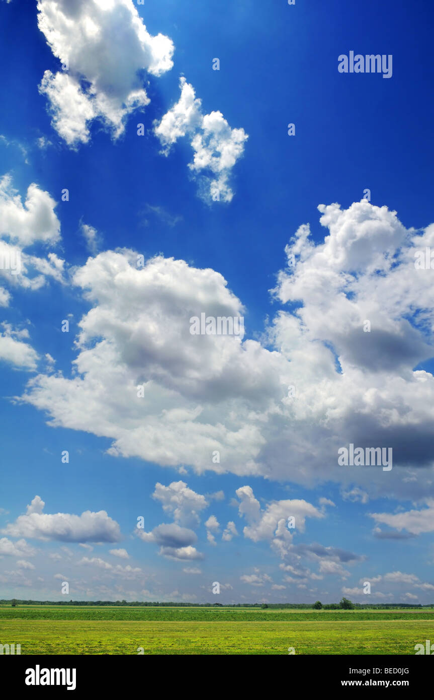 Colorful landscape with clouds and meadow Stock Photo