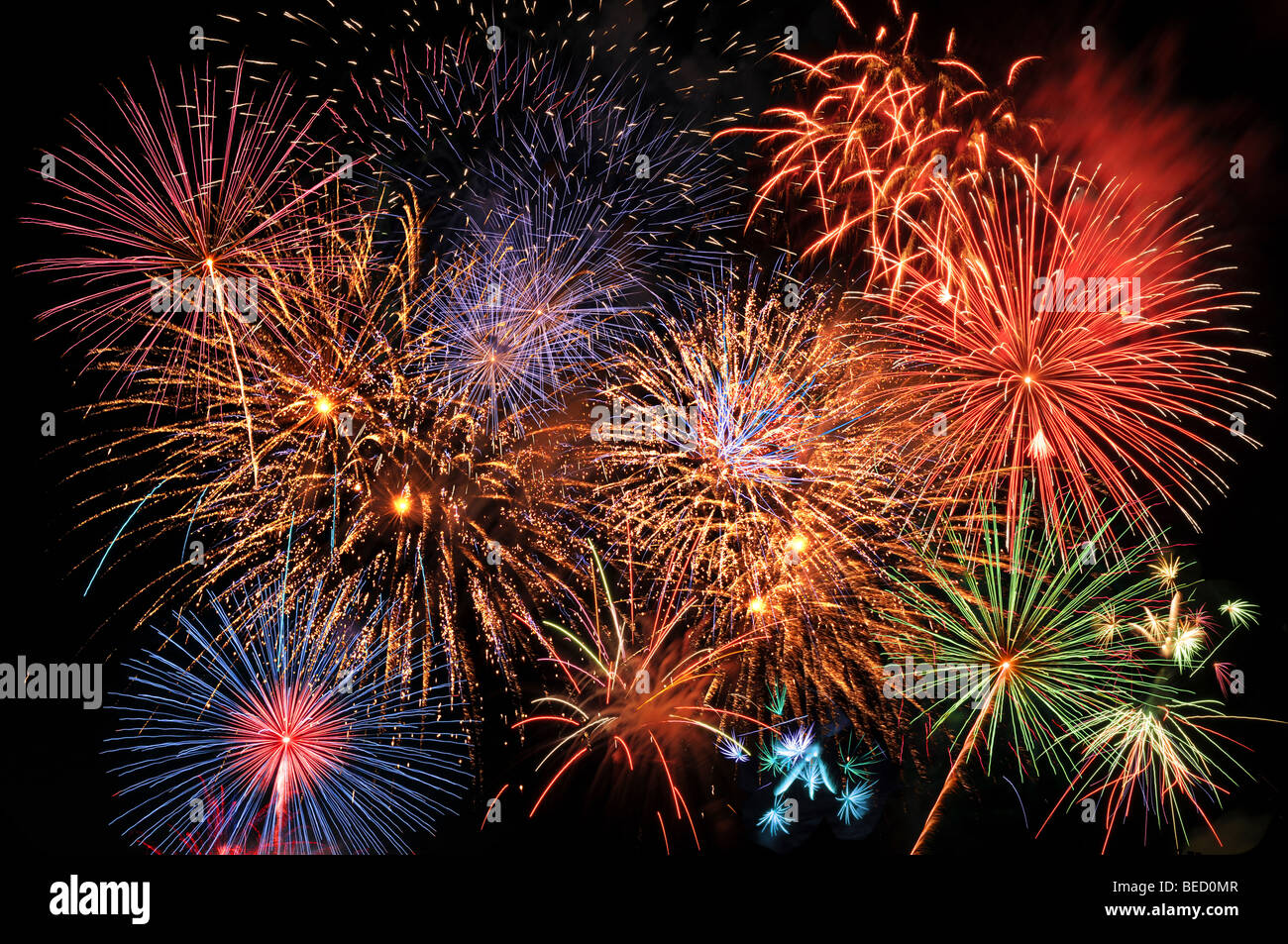 Colorful fireworks lighting the night sky Stock Photo