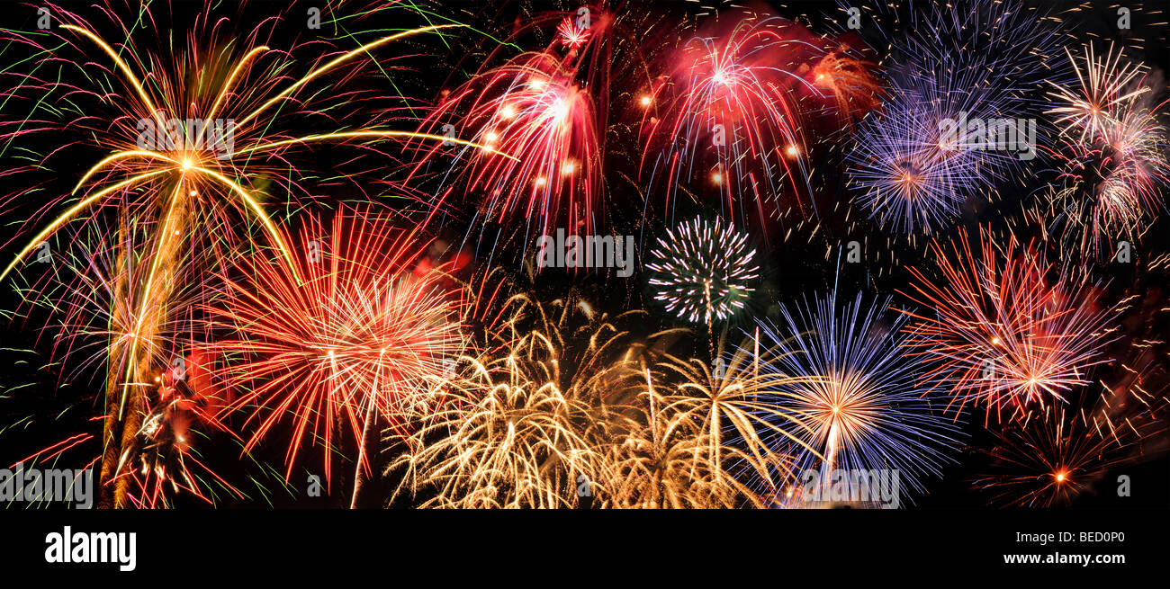 Fireworks of different colors over a night sky Stock Photo