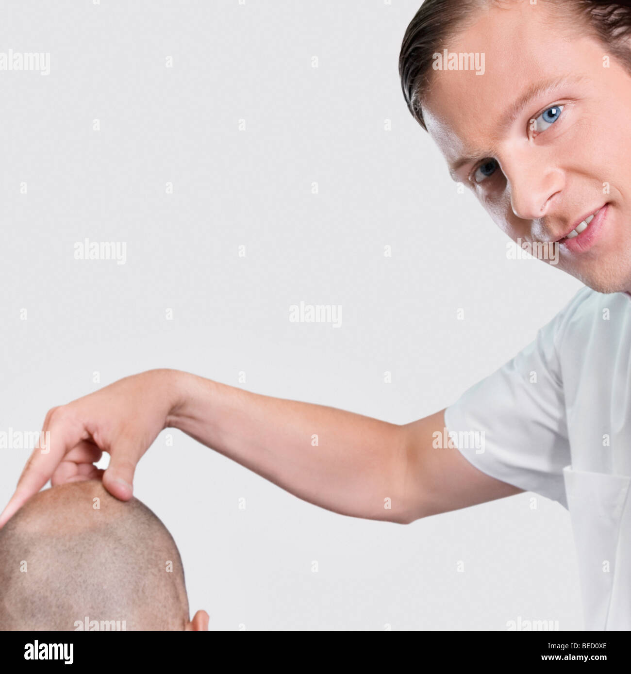 Barber massaging a man's head Stock Photo