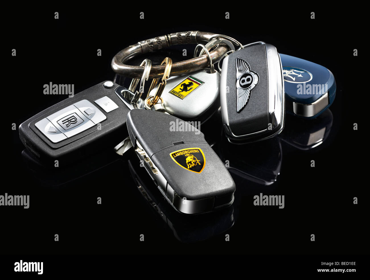 Car keys of various high-class brands on an antique key ring Stock Photo