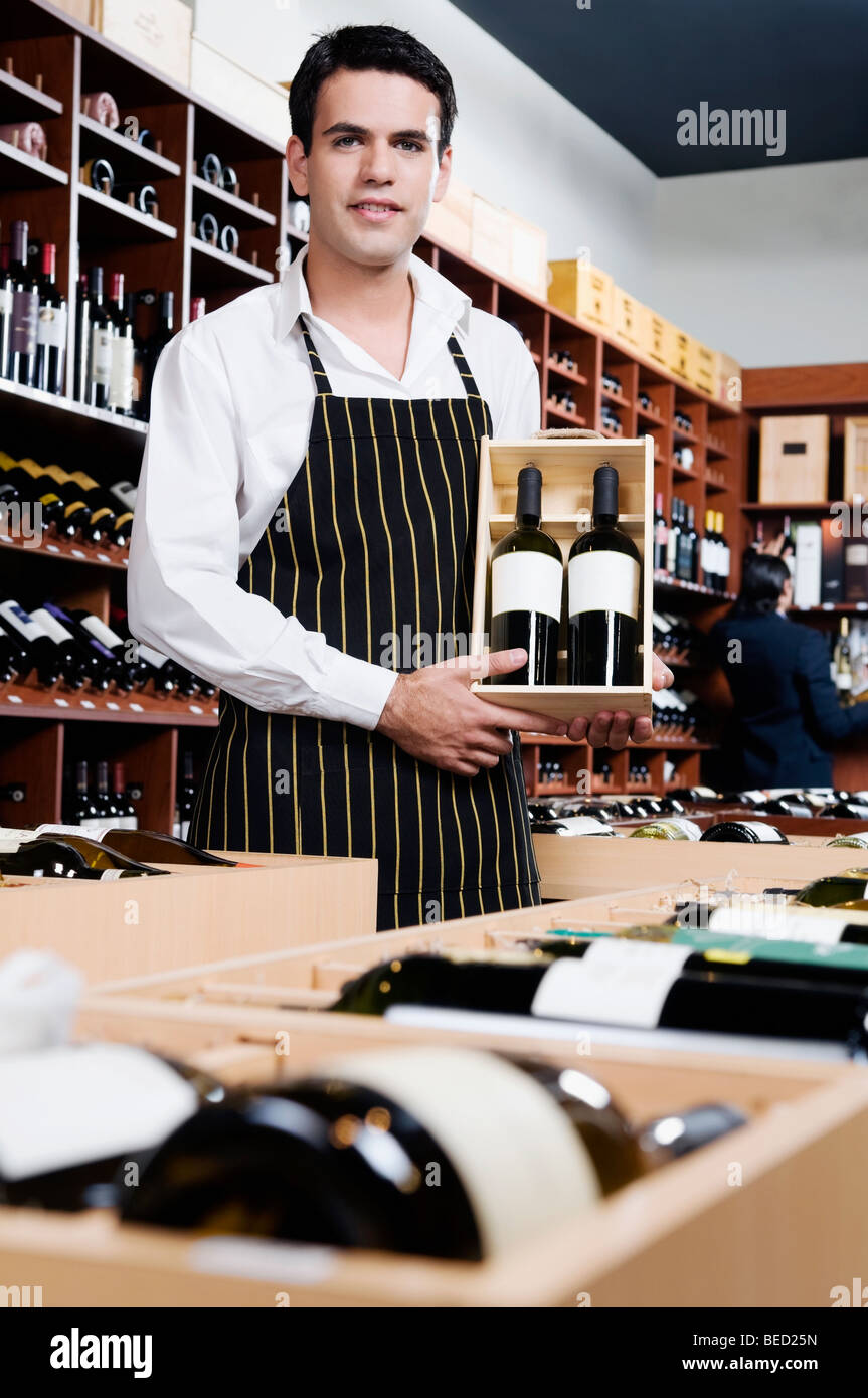 Two men holding up bottles hi-res stock photography and images - Alamy