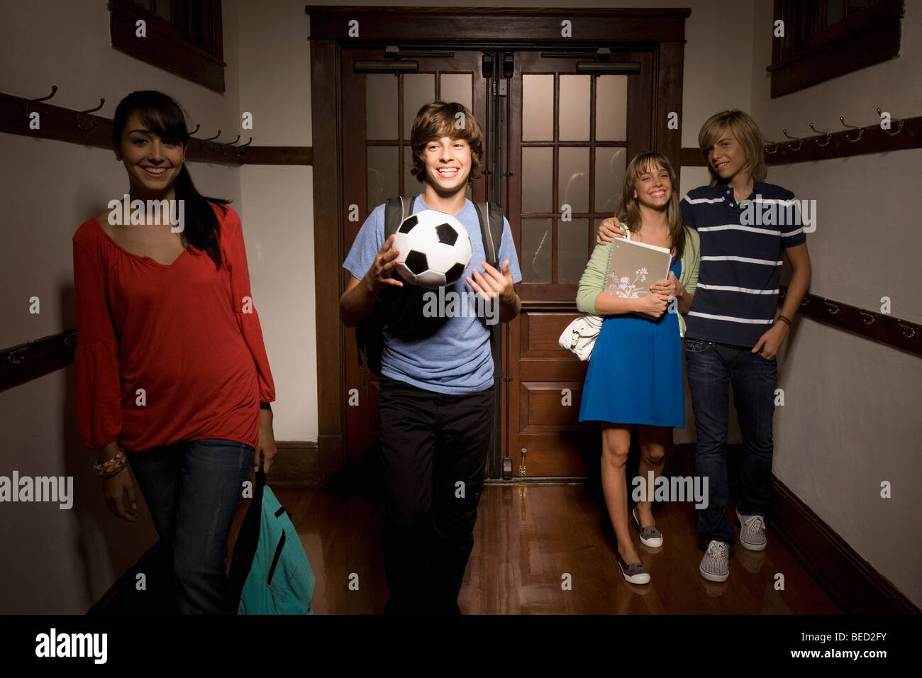 Students walking in the school corridor Stock Photo - Alamy