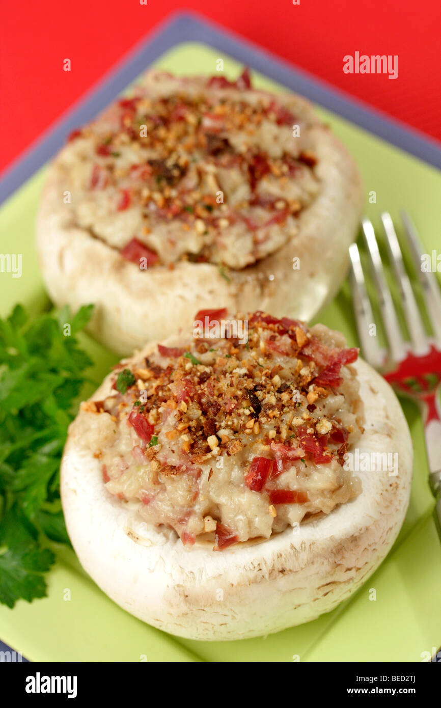 Stuffed mushrooms with ham. Recipe available. Stock Photo