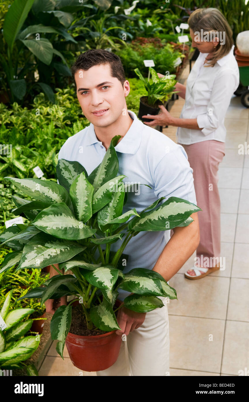 Man with a potted plant hi-res stock photography and images - Alamy
