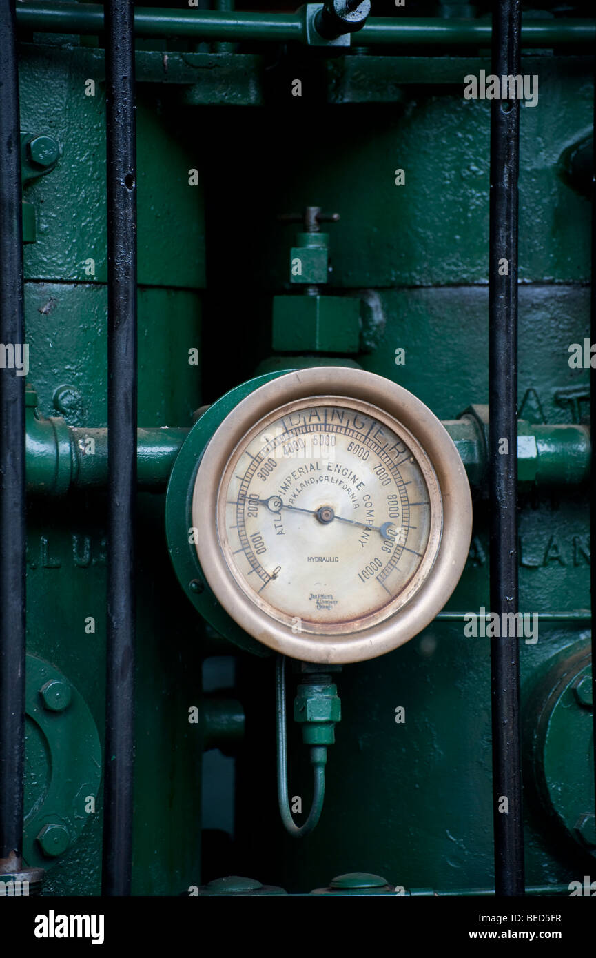 Seen at the Lynden, Washington Antique Machinery Show, the knobs, dial and handle are part of an engine running on steam power. Stock Photo