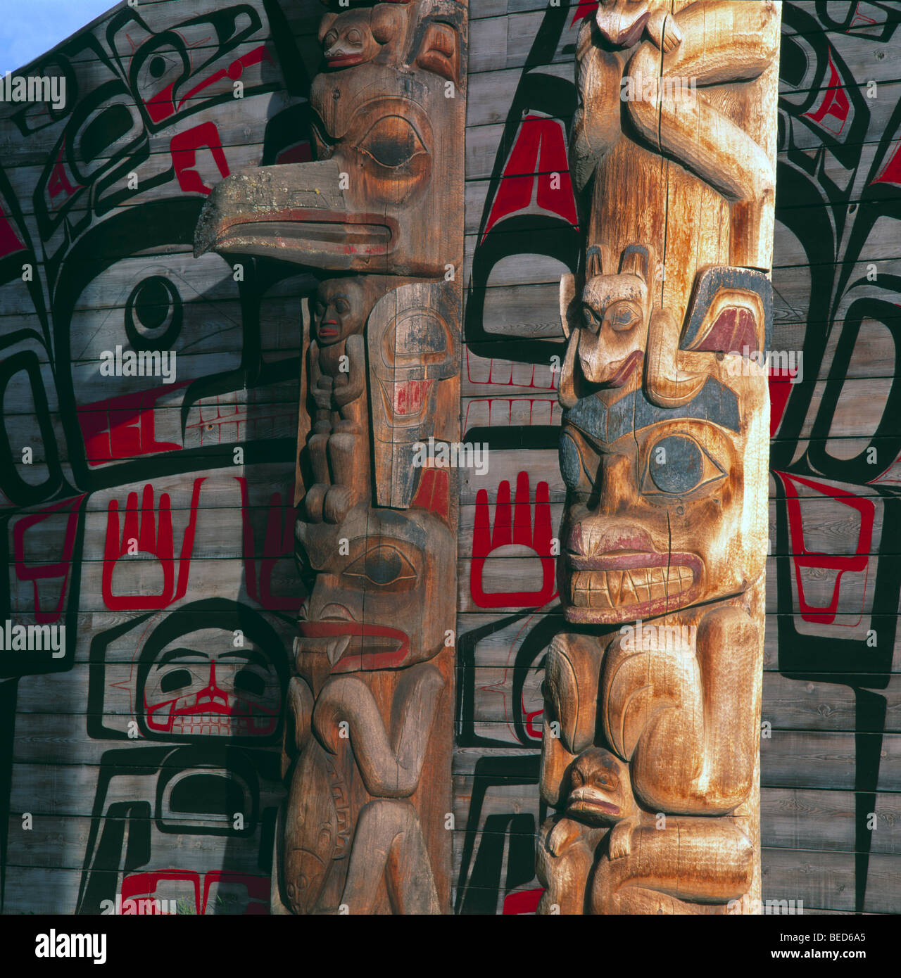 Gitxsan (Gitksan) Totem Poles and Tribal House, Ksan Historical Village and Museum, Hazelton, BC, British Columbia, Canada Stock Photo