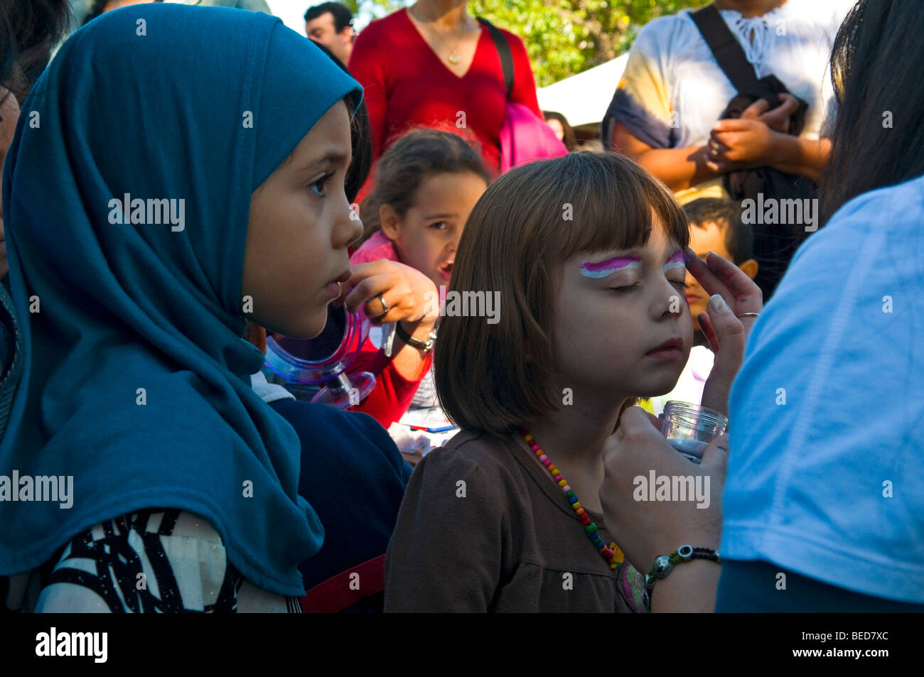 Street Fair Children getting make-up on their faces Montreal canada Stock Photo