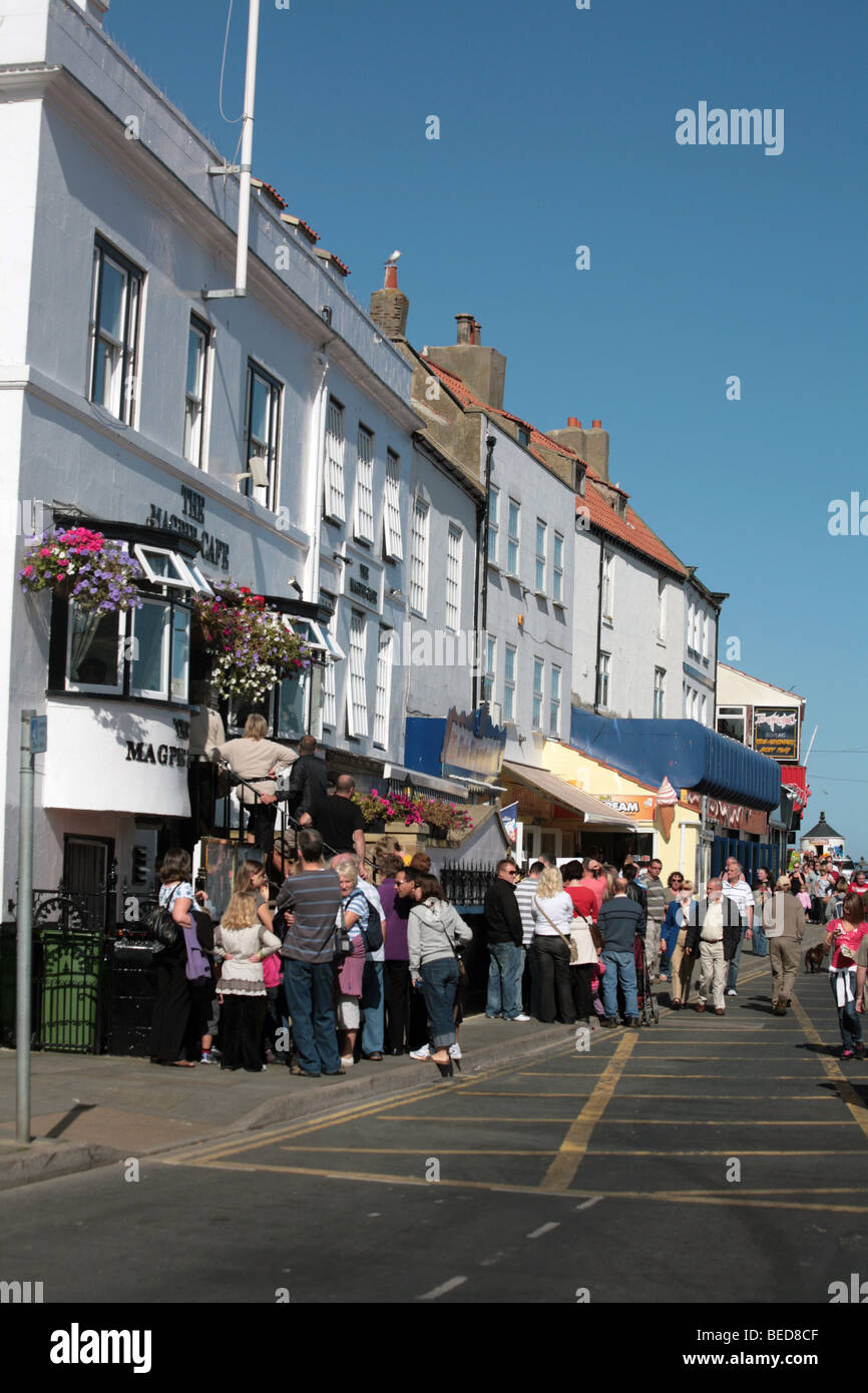 Visitors queuing outside The Magpie Cafe Whitby North Yorkshire England Stock Photo