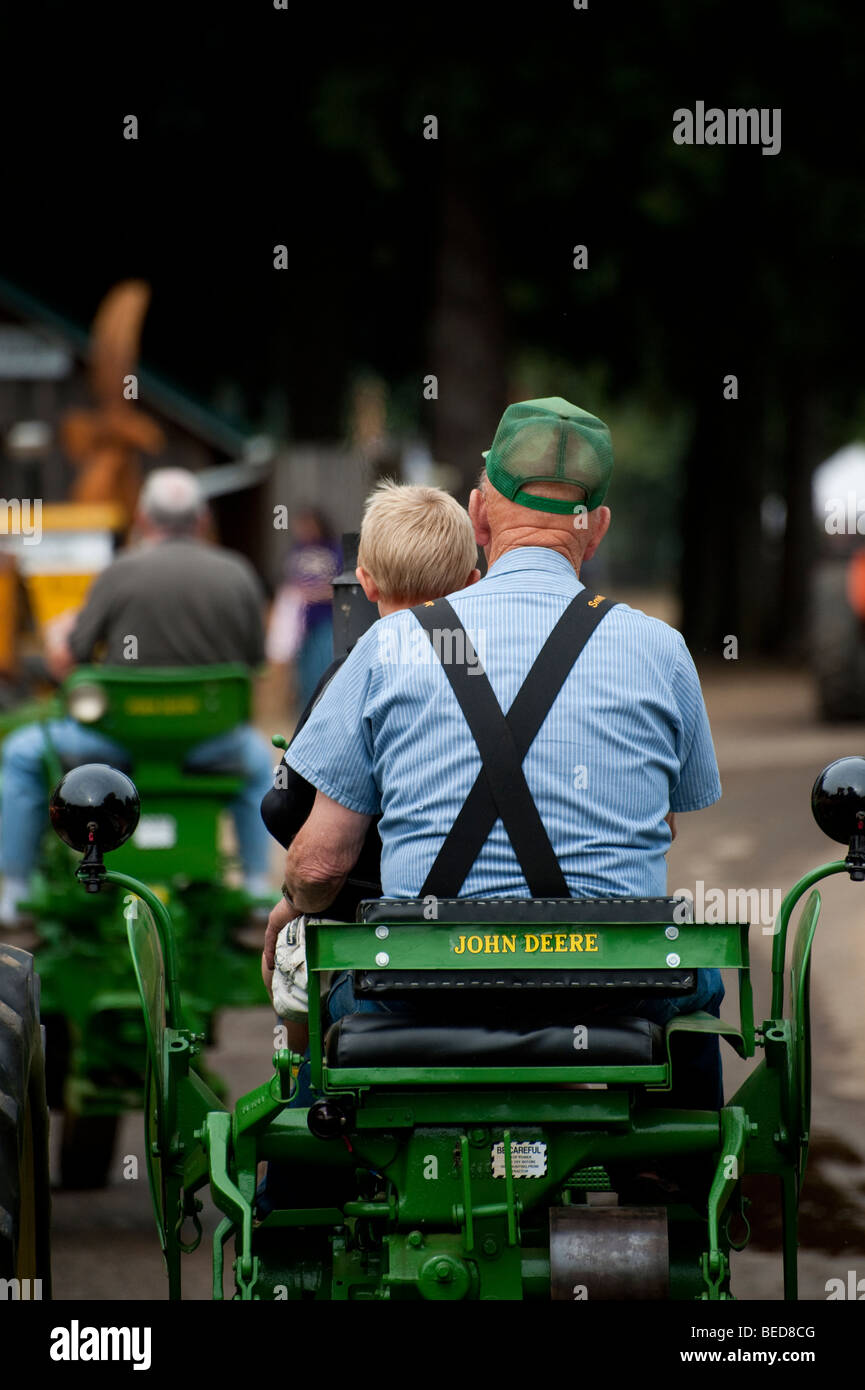 Tractor senior grandfather ride love hires stock photography and