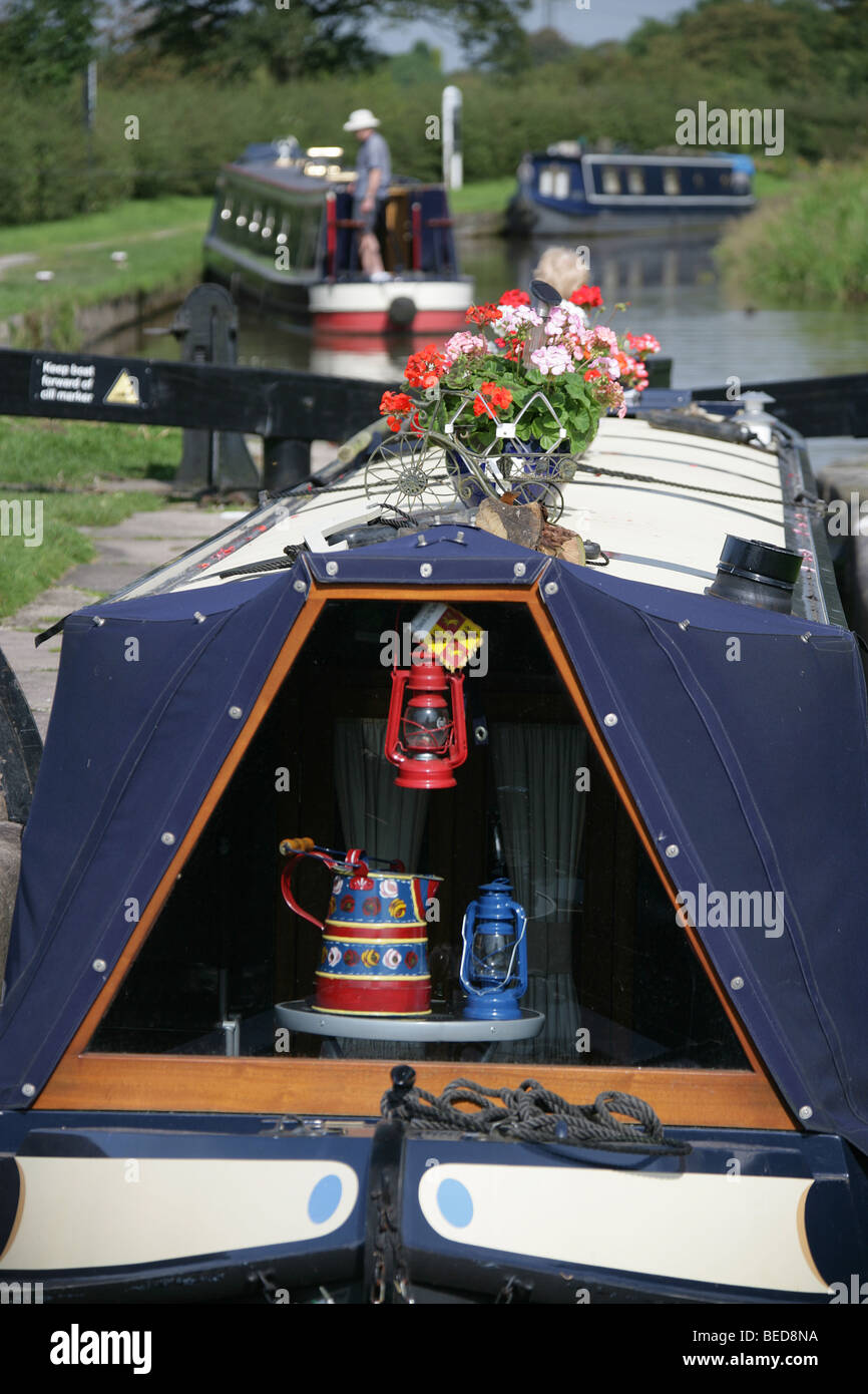 East Cheshire, England. Canal boat transiting the Macclesfield Canal at Bosley Locks. Stock Photo