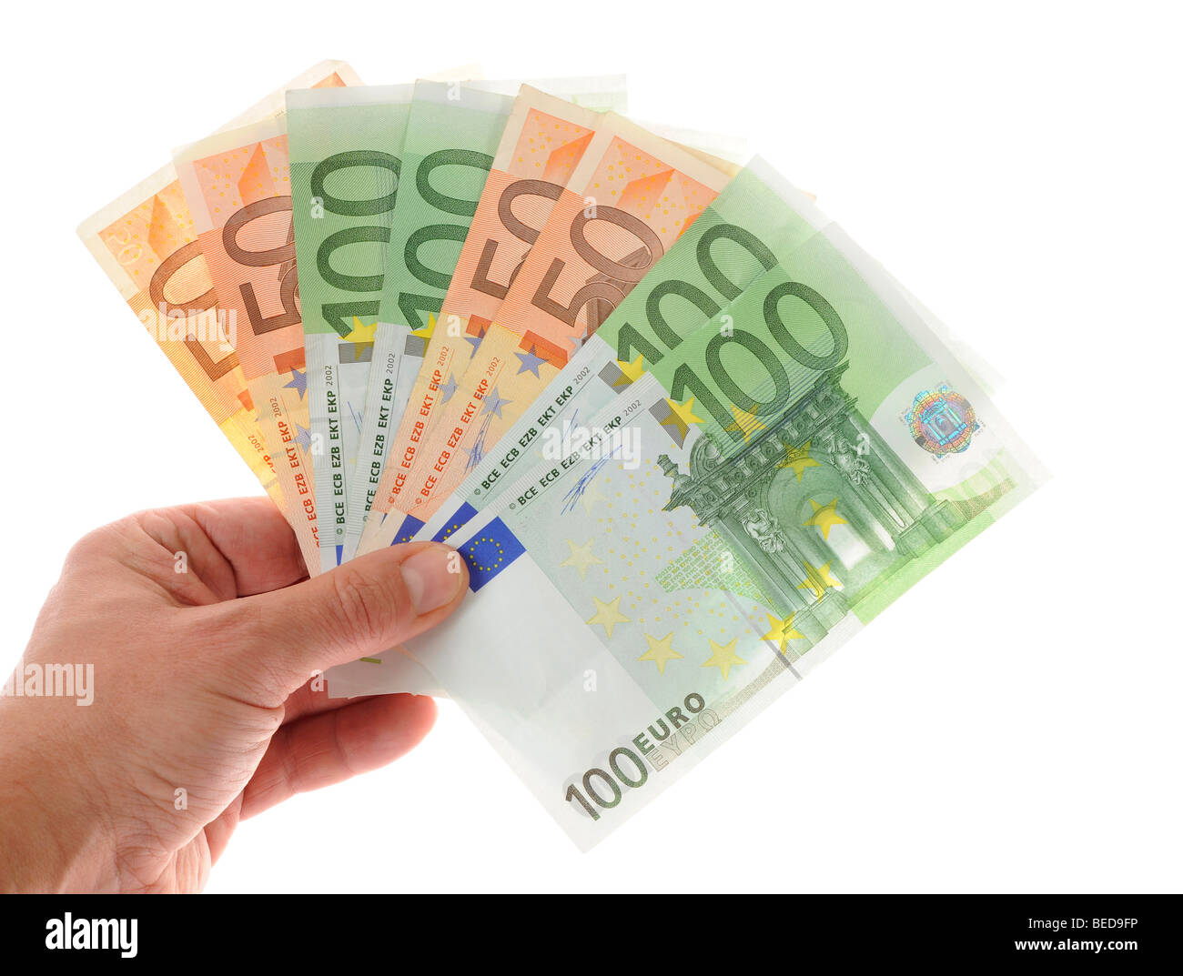 Hand holding a fan of banknotes Stock Photo
