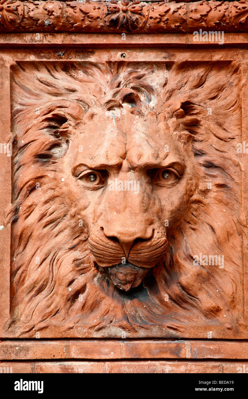 Stone sculpture of lion's face and mane in column at Flagler College in St. Augustine, Florida, USA Stock Photo