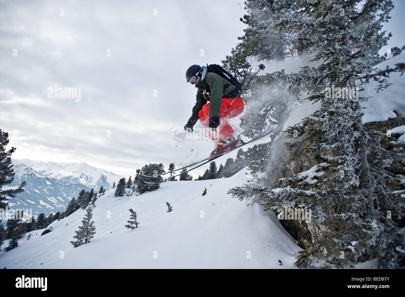 Deep-snow skier, freerider, jumping over rocks, Zillertal Alps, Tyrol, Austria, Europe Stock Photo