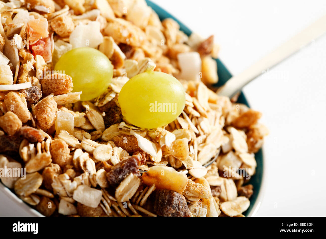 Fruit musli and grapes in a bowl Stock Photo