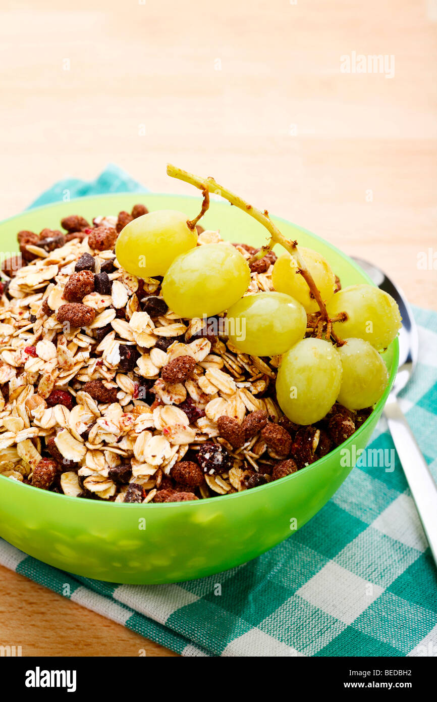 Chocolate muesli and grapes in a bowl Stock Photo