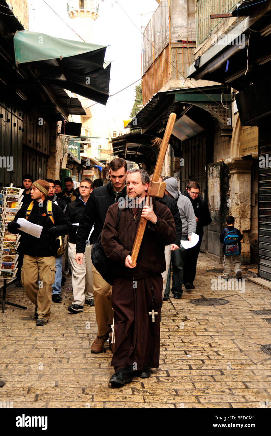 Christian pilgrims with a wooden cross on the Via Dolorosa, Way of Sorrows, Stations of the Cross, Jerusalem, Israel, the Near  Stock Photo
