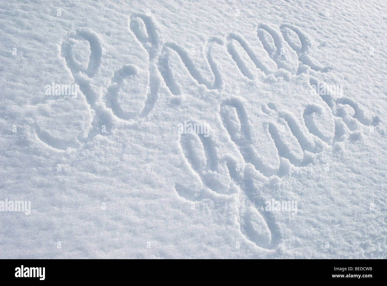 The word SchneeGlueck, snow happiness, written on an untouched blanket