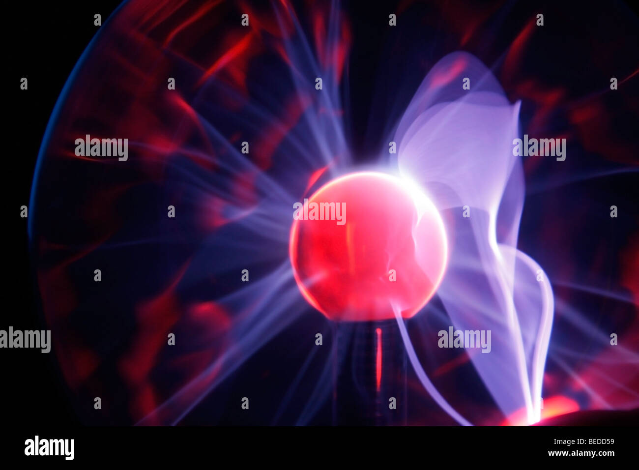 Electric plasma sphere showing flares of plasma Stock Photo