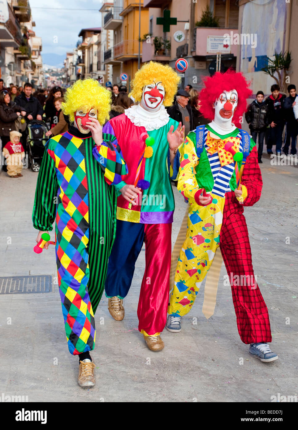 Three men dressed up as clowns, carnival on Shrove Tuesday, Balestrate, Sicily, Italy, Southern Europe Stock Photo