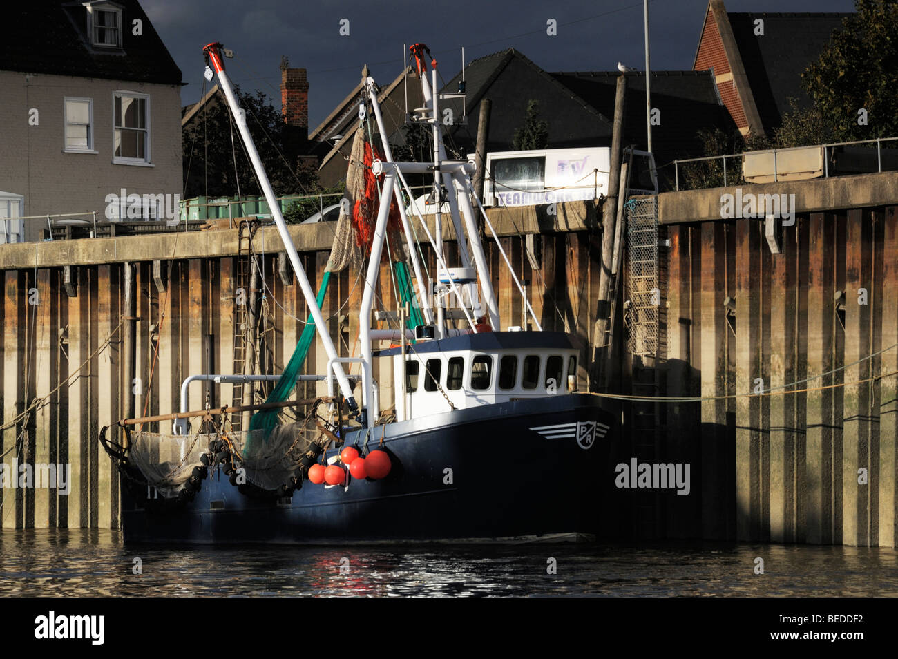 Fishing boat moored at quayside Stock Photo Alamy