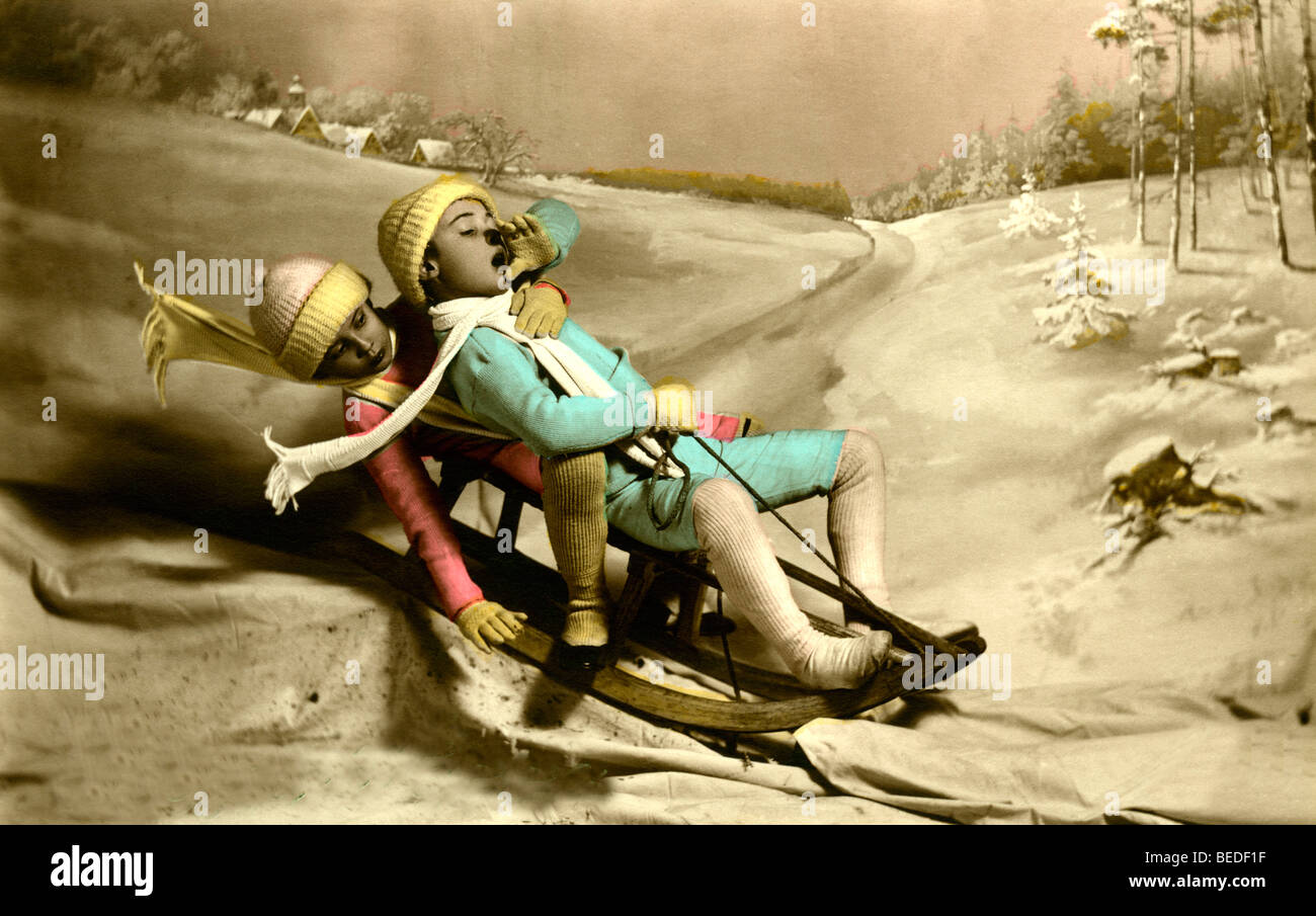 Historic photograph, two children riding a sled, around 1916 Stock Photo